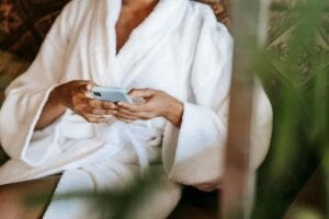 Woman on smartphone searching for med spa and aesthetic clinic services using AI search