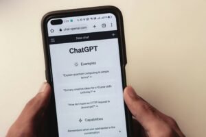 Hands holding smartphone displaying ChatGPT interface, representing how patients use AI chat to find med spa recommendations
