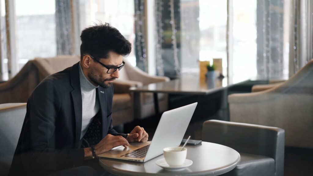 B2B buyer researching software vendors on a laptop, illustrating why companies need Perplexity for B2B AI search visibility