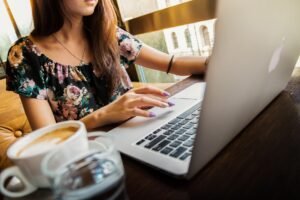 Woman researching med spa options on laptop using AI search tools like Perplexity